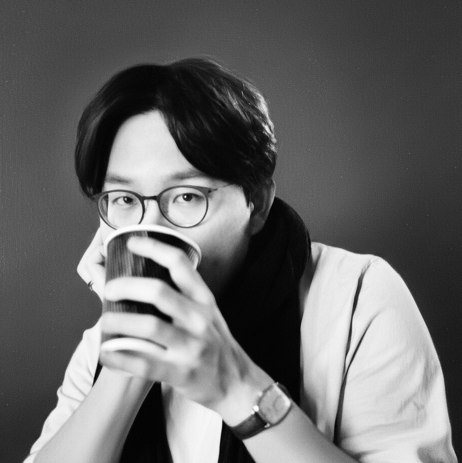 Wesley holding a paper cup in a black-and-white portrait
